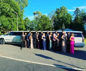 Prom couples with luxury limousine for prom night transportation