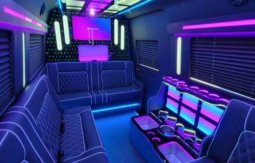 Luxury limousine interior in Westchester NY with modern blue and purple LED lighting.